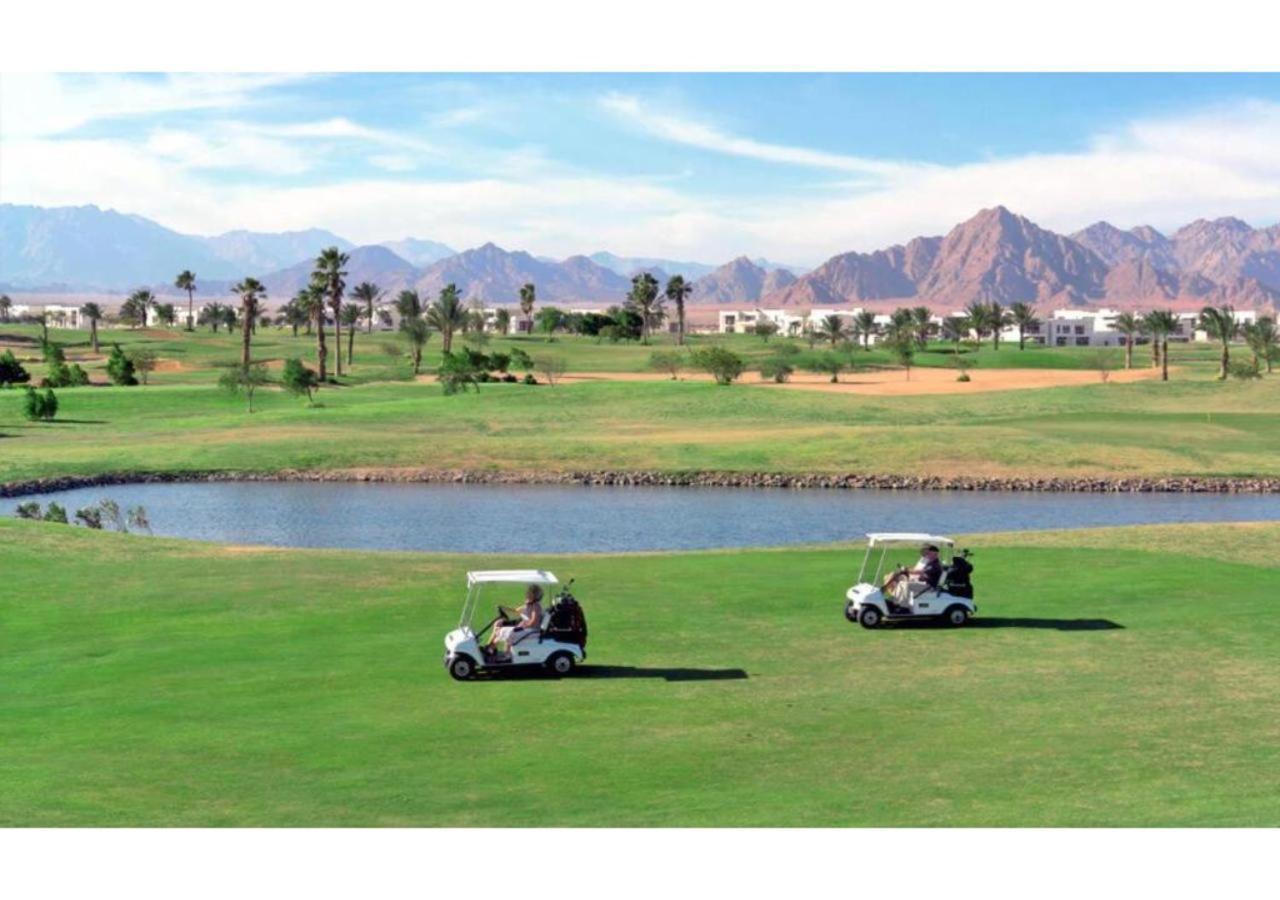 Rixos Premium Seagate Hotel Sharm el-Sheikh Exterior photo Golf carts at the Al-Ahli Golf Club, in the desert of Egypt